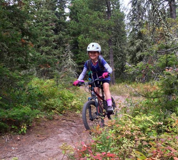 Girl Wearing Helmet Riding Kid's Mountain Bike in Bozeman