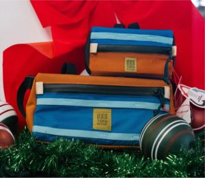 two topo designs handlebar bags arranged for a holiday display
