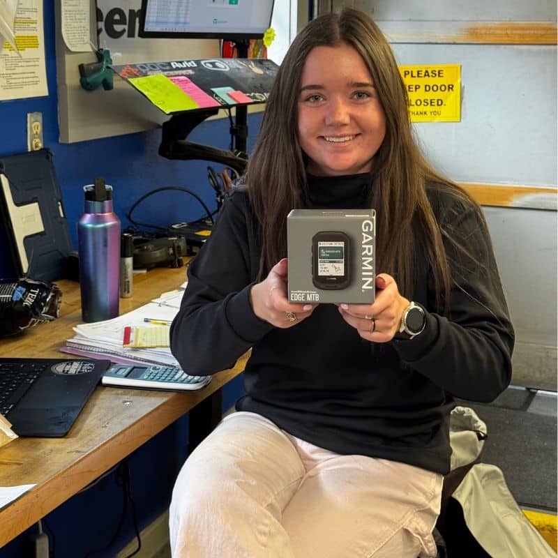 cadel holding a garmin mtb edge bike computer
