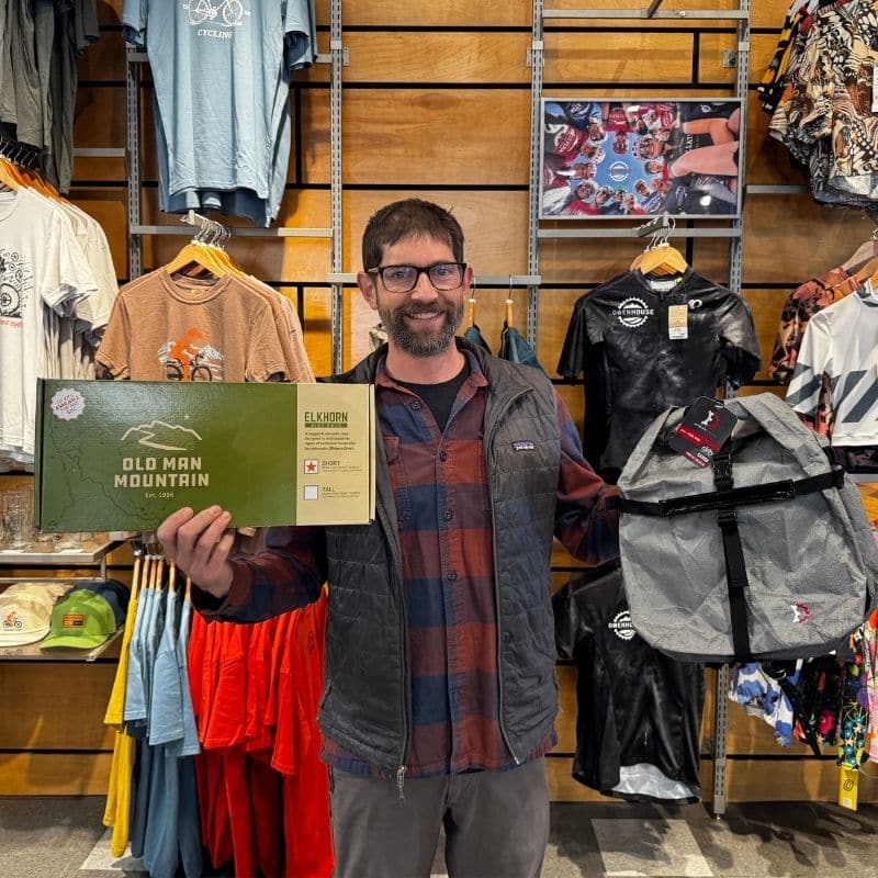 Eric holding old man mountain rack and revelate panniers