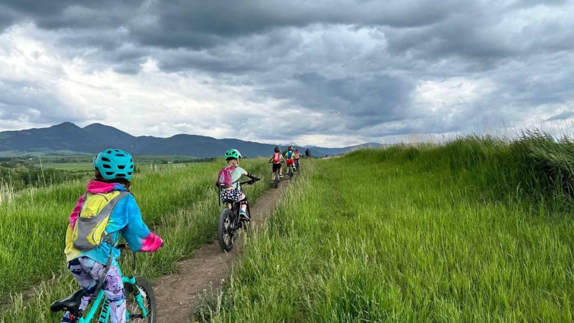 group of kids biking on a trail in Bozeman, Montana