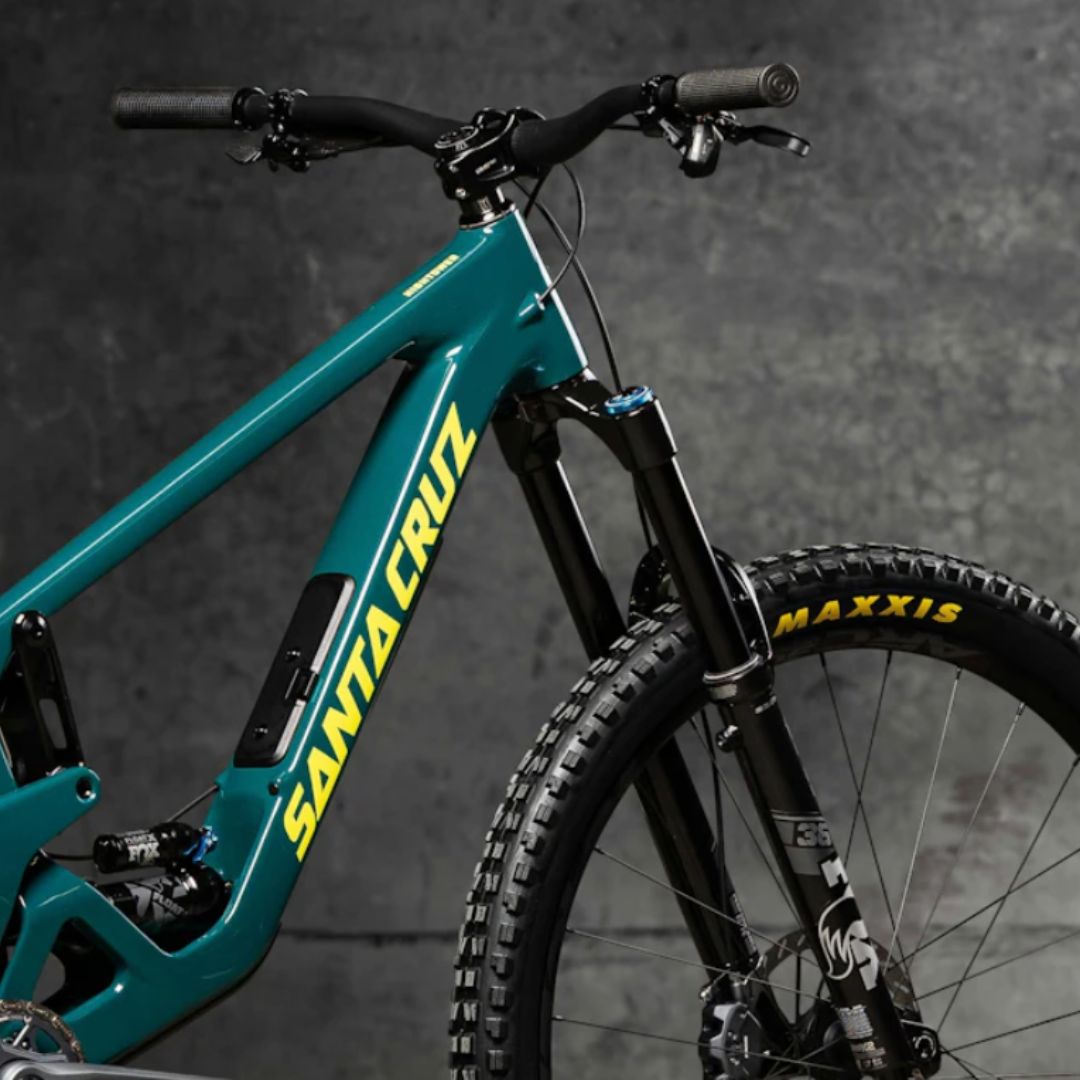 santa cruz hightower bike - teal color with yellow branded writing