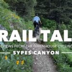trail talk sypes canyon mountain biker on sypes trail green plants yellow flowers in foreground