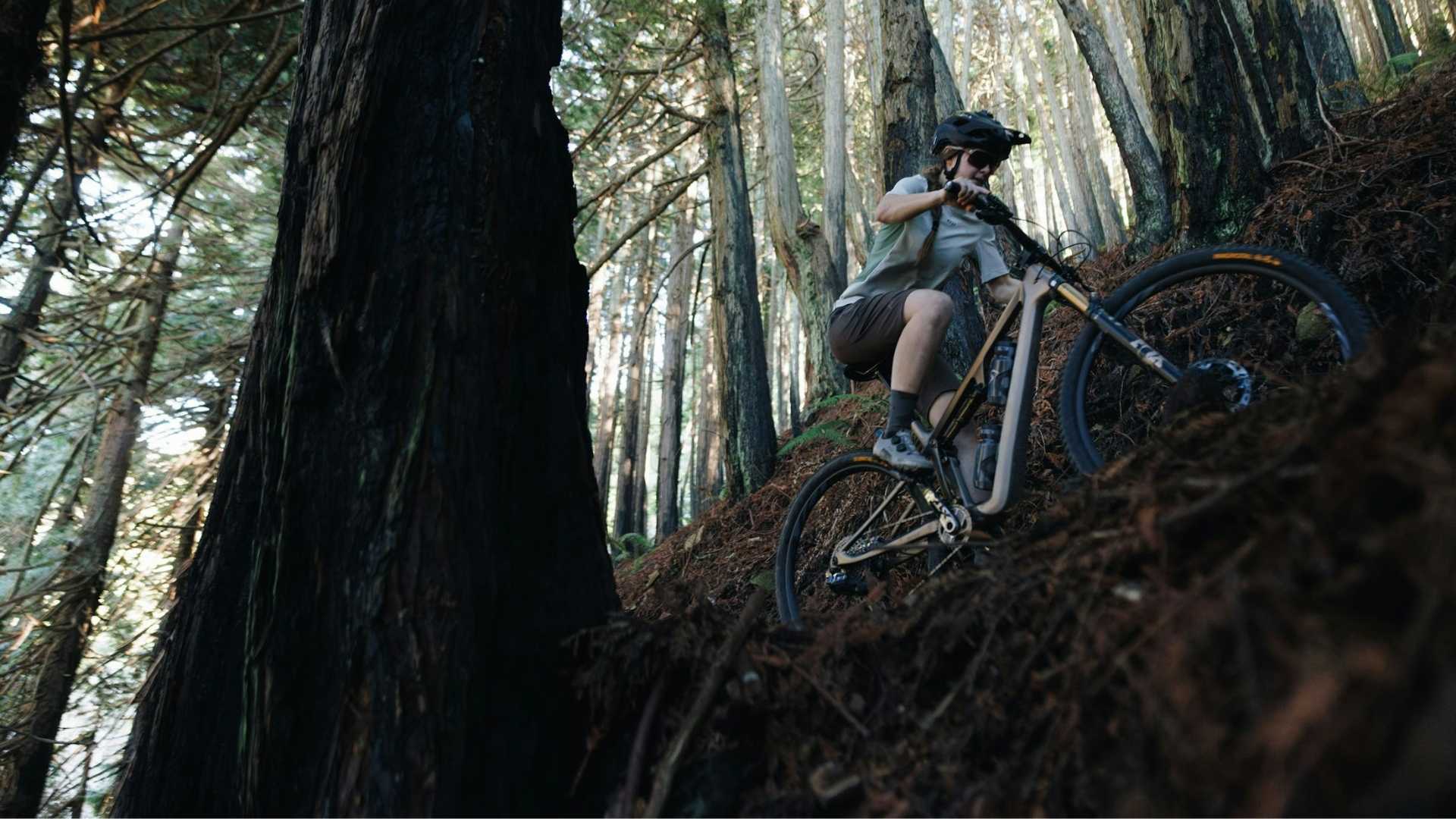 woman riding the 2026 Ripley SL on a forested trail